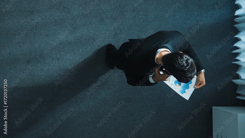 Aufkleber top view of smart male leader calling phone while project manager give financial document. businessm