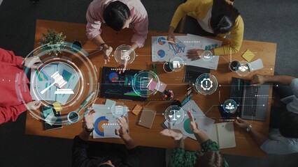 A modern business meeting showcasing teamwork and collaboration while analyzing charts and graphs,...