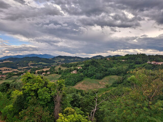 scenic green hilly panorama under a cloudy sky