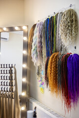 Variety of colorful hair extensions displayed in a well-lit salon setting highlighting creativity and style