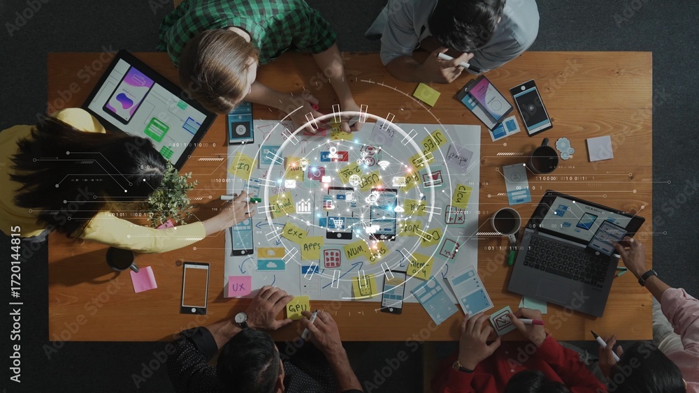 Poster overhead view of a diverse team engaged in creative collaboration with digital devices, brainstormin