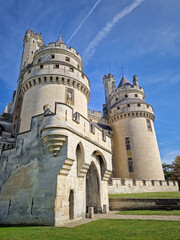 Chateau de Pierrefonds romanticized french medieval architecture with imposing towers and...