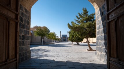 Obraz premium Overhead Shot of a Mosque Courtyard Surrounded by Trees and Stone Architecture