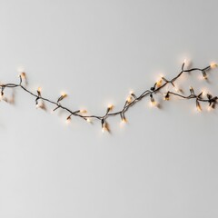 Obraz premium Decorative string lights with warm glowing bulbs arranged on a neutral background, creating a cozy atmosphere for festive occasions and enhancing interior design aesthetics