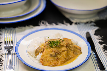 Typical Czech cuisine pork slice on mushrooms with rice
