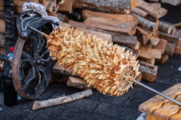 Lithuanian tree cake, šakotis or baumkuchenas, Polish sękacz, Belarusian bankucha, German baumkuchen made of butter, egg whites and yolks, flour, sugar, and cream, cooked over an open fire