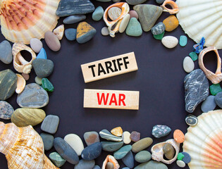 Trade tariff war symbol. Concept word Tariff war on beautiful wooden blocks. Beautiful black paper...