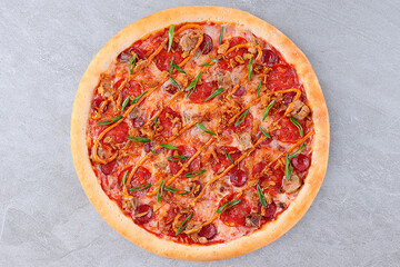 Delicious Meat Pizza with Pepperoni, Bacon, Sausage, Green Onions, and Crispy Onions on Tomato Sauce and Melted Cheese