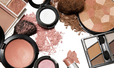 Flat Lay of Makeup Products with Brushes and Powder