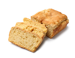 Freshly baked cut cornbread isolated on white
