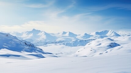 Vast snow covered mountain range under clear blue sky winter mountains