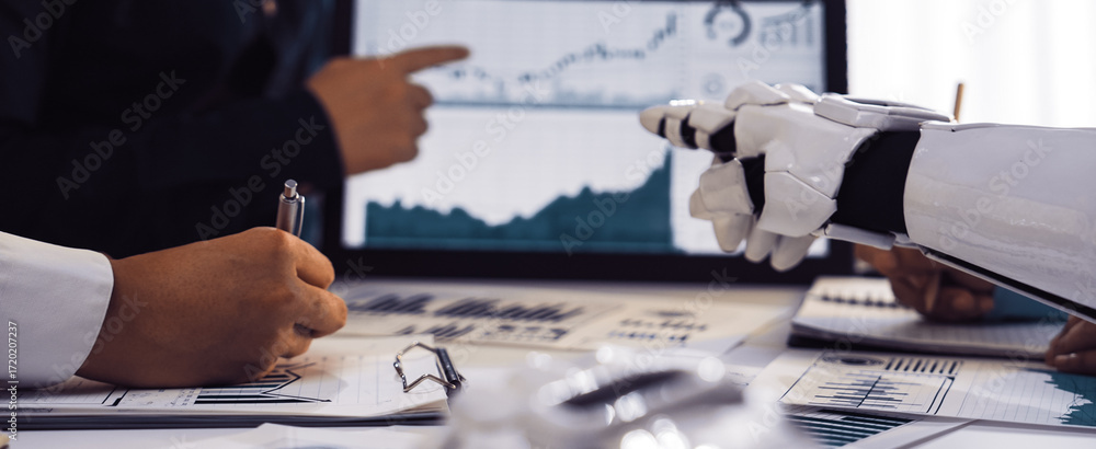 Poster a business team collaborates in a modern office, analyzing data trends with the aid of advanced robo