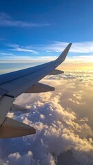 Fototapeta premium Airplane wing over a vast cloud field at sunset