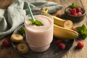 Refreshing banana raspberry smoothie with fresh mint for healthy living and summer enjoyment.