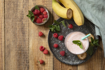 Refreshing banana raspberry smoothie with fresh mint for healthy living and summer enjoyment.