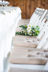 White floral bouquet with roses and daisies arranged in elegant vase for wedding table decoration, natural fresh flowers as romantic festive centerpiece for ceremony, celebration and reception event