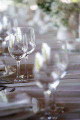 beautiful table setting with flowers and cutlery on wooden table at wedding or dinner. stylish tablewear decorations	