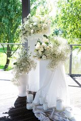 White floral bouquet with roses and daisies arranged in elegant vase for wedding table decoration, natural fresh flowers as romantic festive centerpiece for ceremony, celebration and reception event