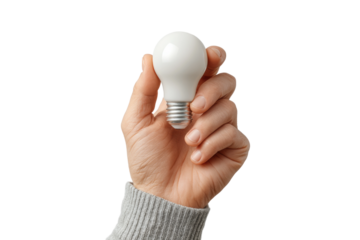 Female hand holding white light bulb isolated on black background, cut out