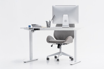 Modern office setup featuring a desk, computer, and telephone with a minimalist design that enhances productivity and organization