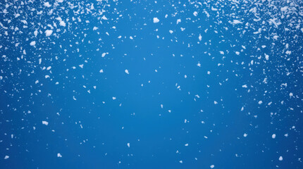 Obraz premium snow is falling on a blue background