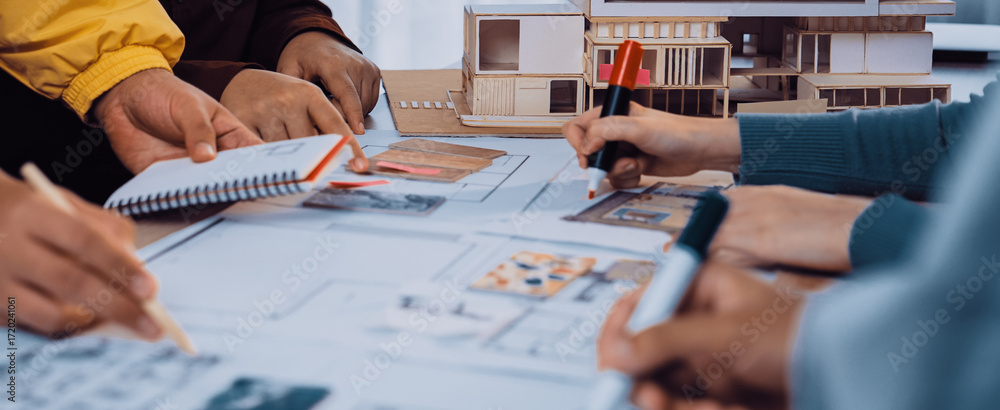 Poster a group of architects and designers collaborates on an architectural project, sketching plans and di