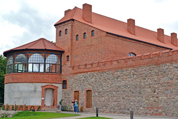 GUREVSK, RUSSIA - JULY 09, 2025: Neuhausen Castle tower and a fragment of the fortress wall. Kaliningrad Oblast