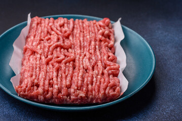 Raw ground beef or pork, prepared meat for burgers or other food preparation. Raw ground beef