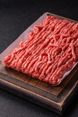 Raw ground beef or pork, prepared meat for burgers or other food preparation. Raw ground beef