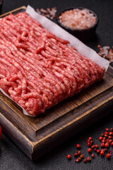 Raw ground beef or pork, prepared meat for burgers or other food preparation. Raw ground beef