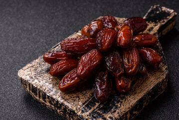 Dried dates in a ceramic plate, arabic food for the ramadan table. Dried dates as a food backgrounds