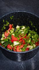 Cucumber tomato salad in the pot