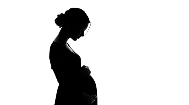 A pregnant woman is standing in front of a white background
