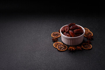 Dried dates in a ceramic plate, arabic food for the ramadan table. Dried dates as a food backgrounds