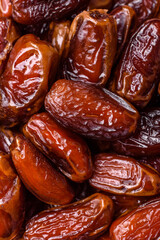 Dried dates in a ceramic plate, arabic food for the ramadan table. Dried dates as a food backgrounds