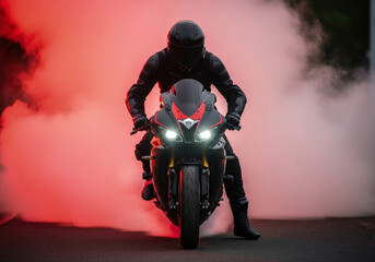 Mysterious Rider on a Sportbike Emerging from Dramatic Red Smoke with Glowing Headlights.