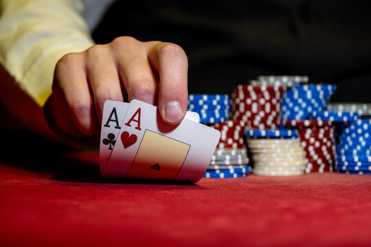 Best gamble in poker or lucky hand concept with player going all in with pocket aces two aces considered the best hand in poker preflop before the flop is revealed
