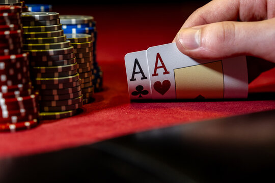 Best gamble in poker or lucky hand concept with player going all in with pocket aces two aces considered the best hand in poker preflop before the flop is revealed