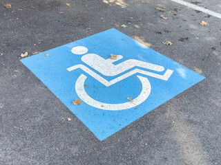Accessible parking space symbol on asphalt