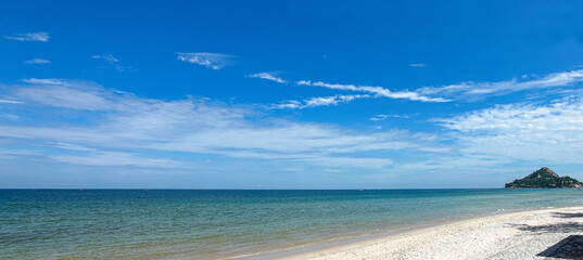 beautiful white clouds, blue sky, sea and beach. scenery of sea.