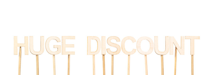 Fototapeta premium Wooden sign with the text Huge Discount, designed to communicate large discounts and final sales