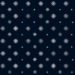 Snowflakes fall gently on a dark background creating a beautiful winter scene