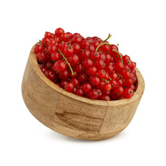red currant berries in a wooden plate on a white isolated background