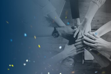 Hands joined over wooden table