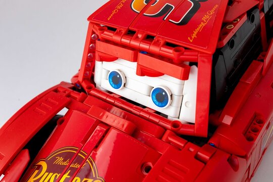 red toy car Lego Lightning McQueen detail logo eyes