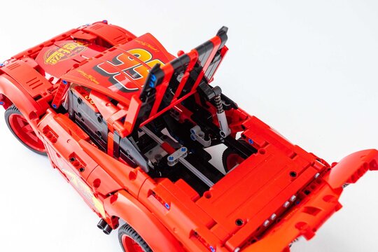 red toy car Lego Lightning McQueen detail logo
