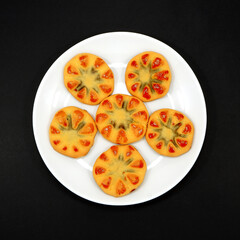 Cookies on white plate with black background flat lay photography 