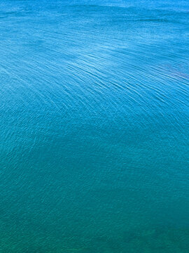 Calm blue rippled sea surface.