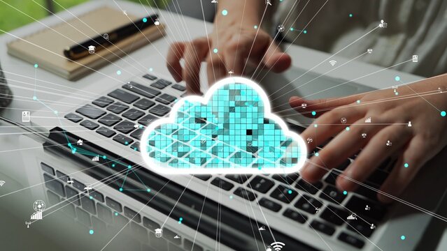A user types on a sleek laptop keyboard in a modern office setting, surrounded by digital cloud computing icons and network connections highlighting technology. Xenic