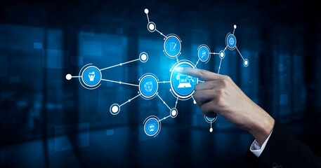 A hand engages with digital icons representing technology and connectivity in a modern business setting, symbolizing innovation and user interaction in the digital age. Tessel
